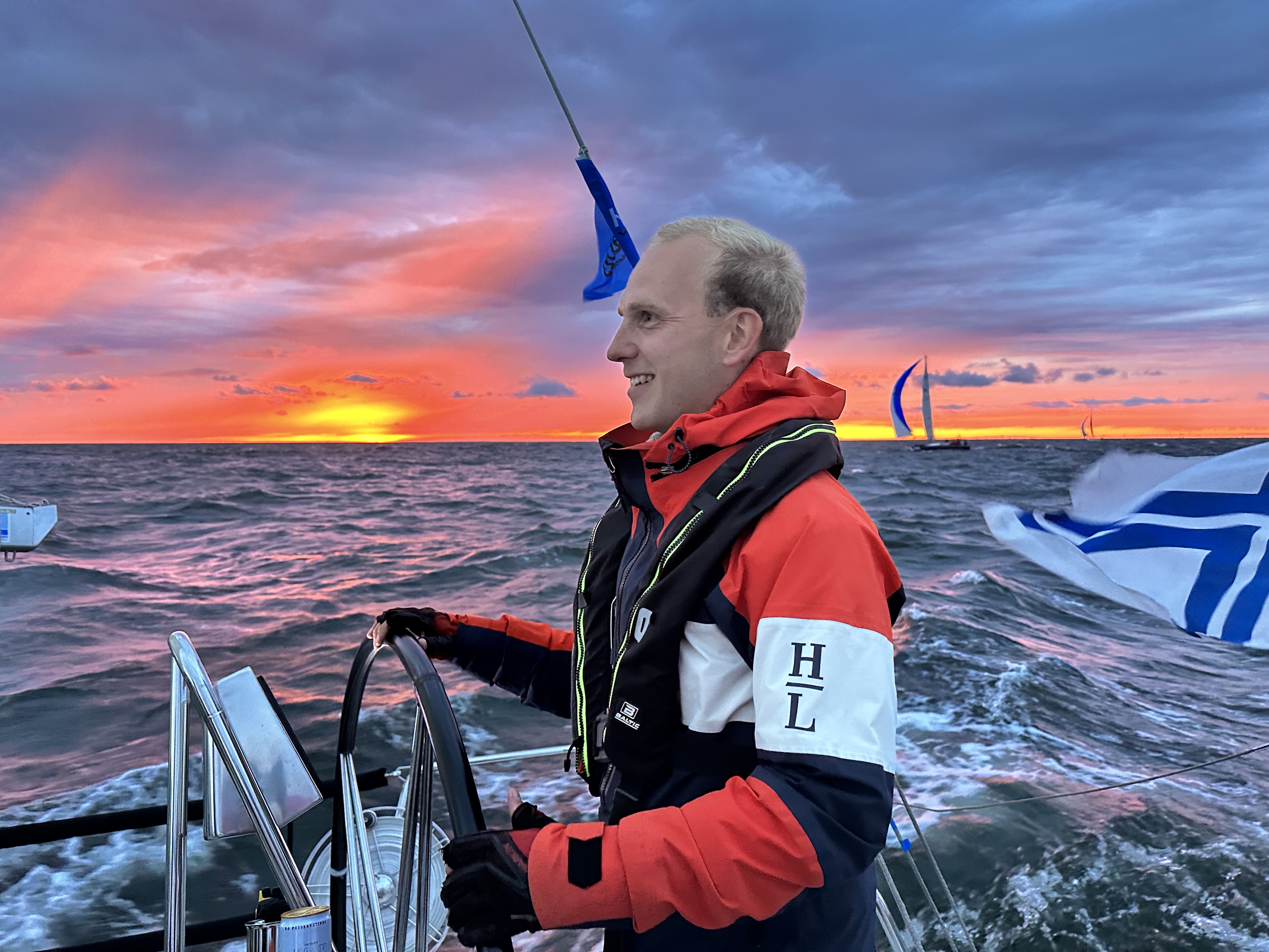 Miikka at the helm at sunset